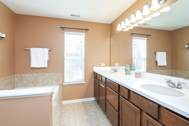 full bath with plenty of natural light, visible vents, and a sink