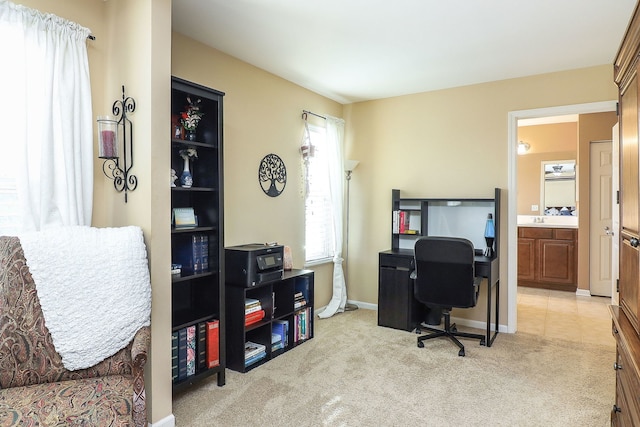 office area with baseboards and light colored carpet