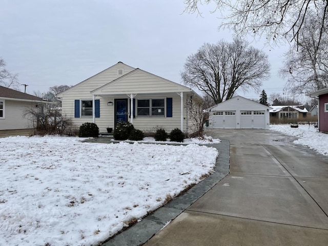 view of front of property featuring a garage and an outdoor structure