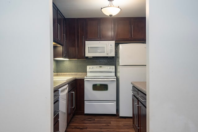 kitchen with white appliances, dark wood-style flooring, light countertops, dark brown cabinets, and backsplash