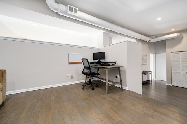 home office with dark wood-type flooring