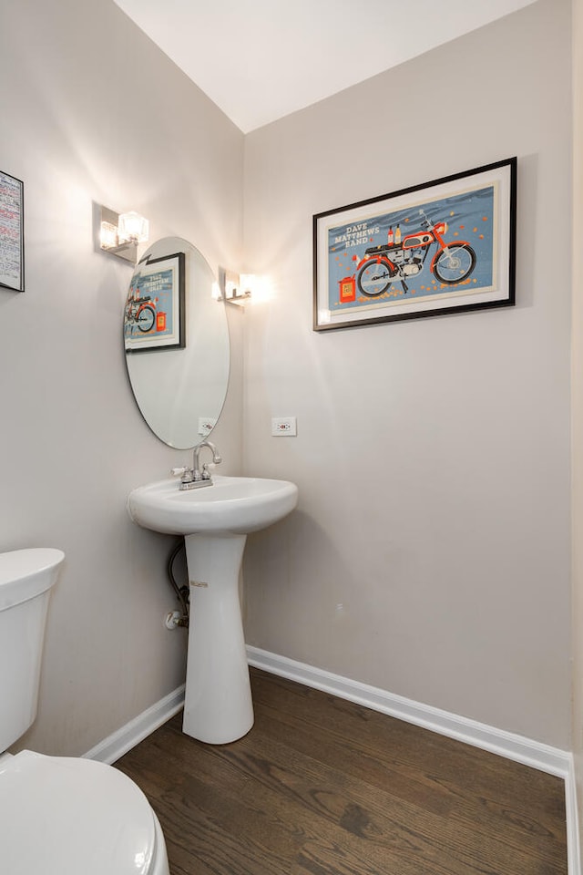 bathroom featuring toilet and hardwood / wood-style flooring