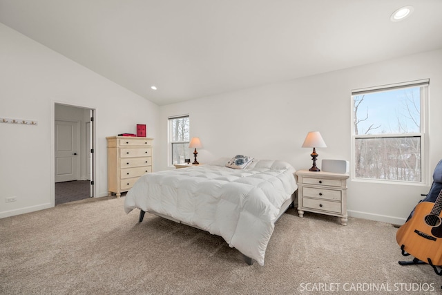 bedroom featuring lofted ceiling and carpet flooring
