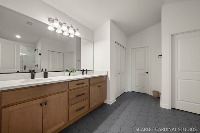 bathroom featuring vanity, lofted ceiling, and an enclosed shower
