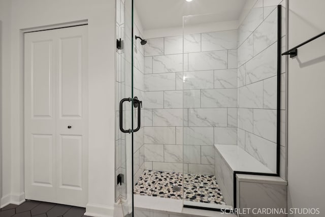 bathroom featuring a shower with shower door