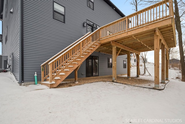 exterior space with cooling unit and a wooden deck