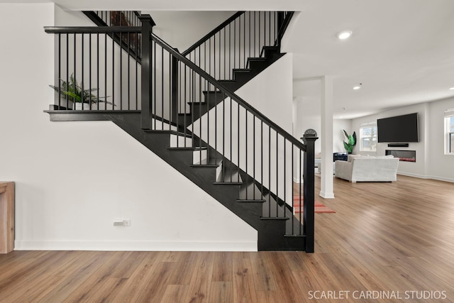 stairway featuring hardwood / wood-style flooring