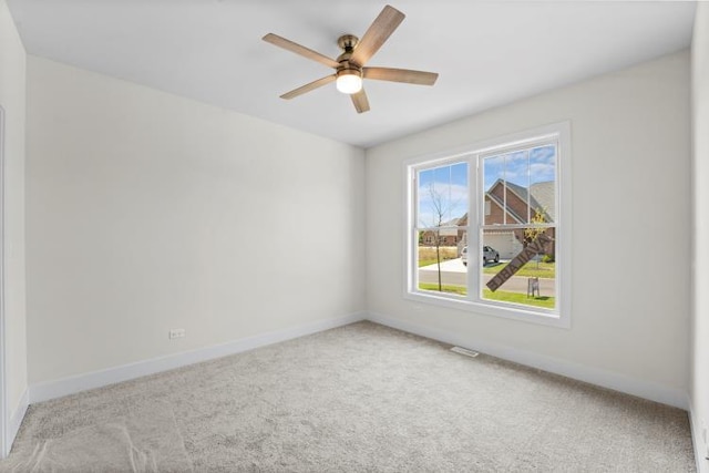 carpeted empty room with ceiling fan