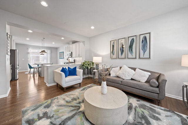 living room featuring dark wood-type flooring