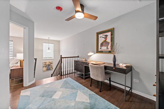 home office featuring dark hardwood / wood-style floors and ceiling fan