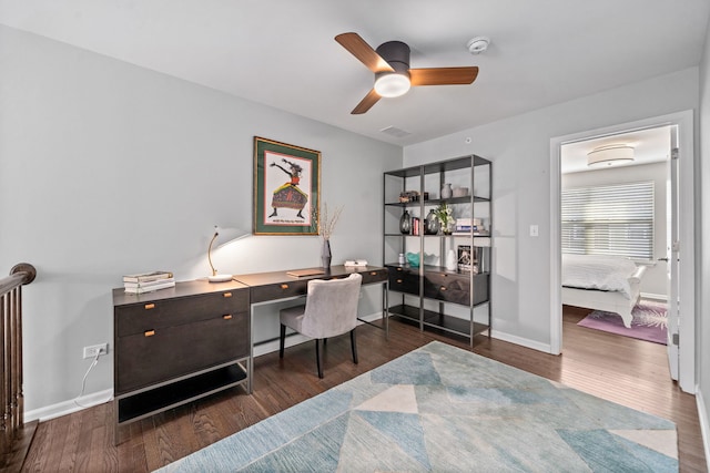 office space with dark wood-type flooring and ceiling fan