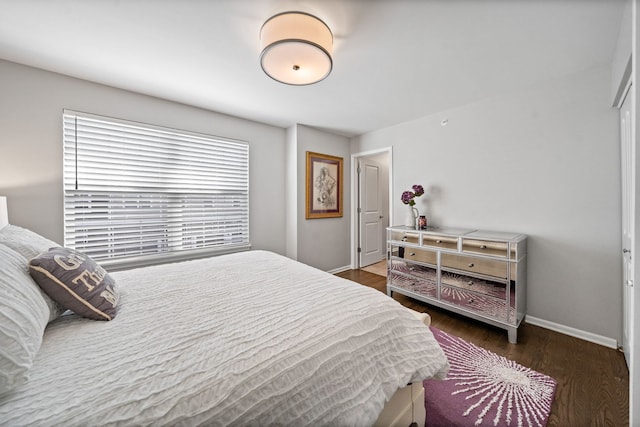 bedroom featuring dark wood-type flooring