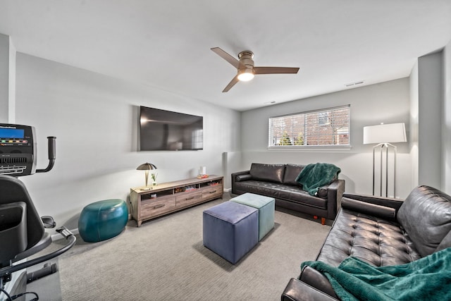 living room with light colored carpet and ceiling fan