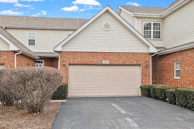 garage featuring driveway