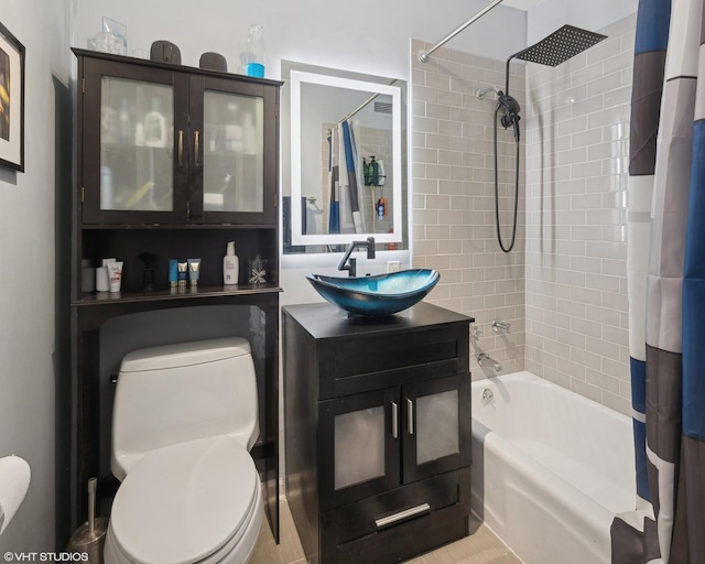 full bath featuring toilet, shower / bathtub combination with curtain, and vanity