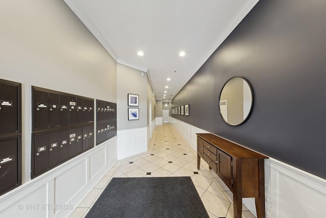 corridor with ornamental molding, light tile patterned floors, mail boxes, and lofted ceiling