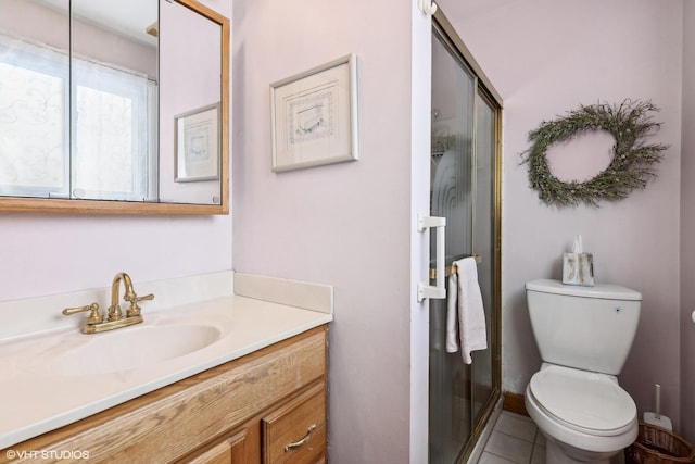 full bathroom with tile patterned flooring, a shower stall, toilet, and vanity