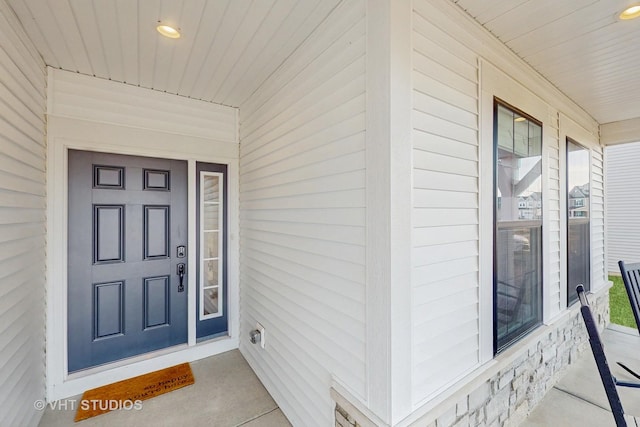 doorway to property with covered porch