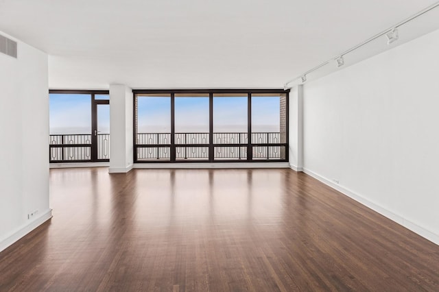 1040 N Lake Shore Dr Unit 34C, Chicago, IL 60611 - empty room featuring wood finished floors and baseboards