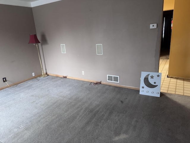 unfurnished room featuring carpet flooring