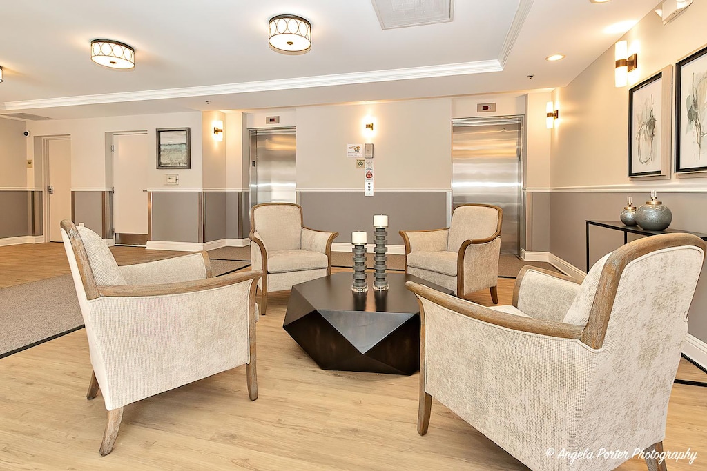lobby with ornamental molding and recessed lighting
