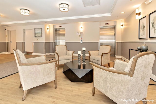 lobby with ornamental molding and recessed lighting