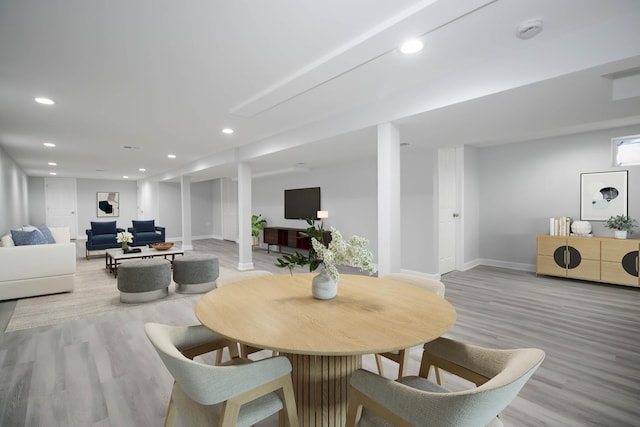 dining area with light hardwood / wood-style floors