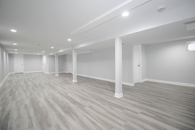 basement featuring light hardwood / wood-style floors