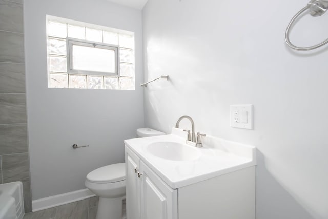 bathroom featuring toilet and vanity