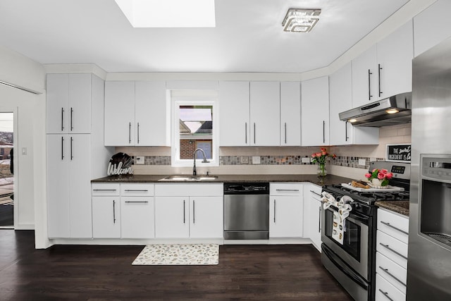 kitchen with white cabinetry, appliances with stainless steel finishes, sink, and tasteful backsplash