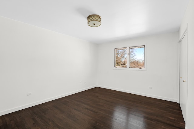 unfurnished bedroom featuring dark hardwood / wood-style flooring