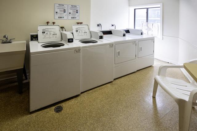 community laundry room featuring washing machine and clothes dryer