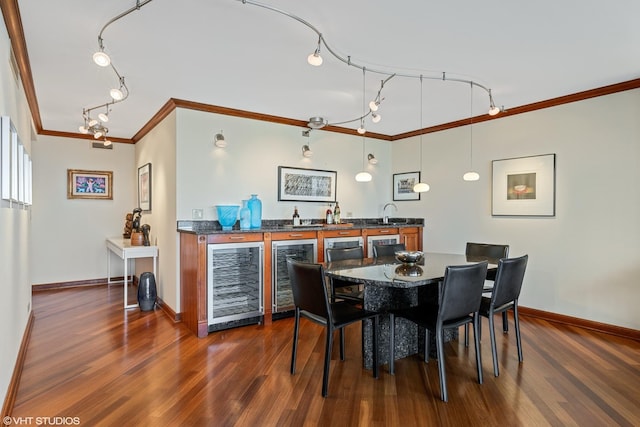 dining space featuring crown molding, indoor bar, beverage cooler, and dark hardwood / wood-style flooring