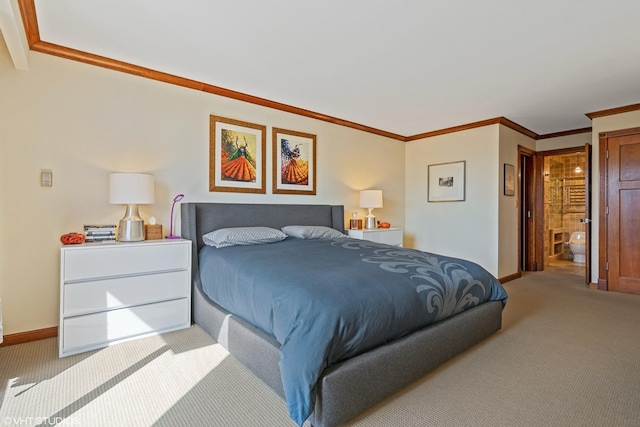 bedroom with crown molding, light colored carpet, and ensuite bathroom