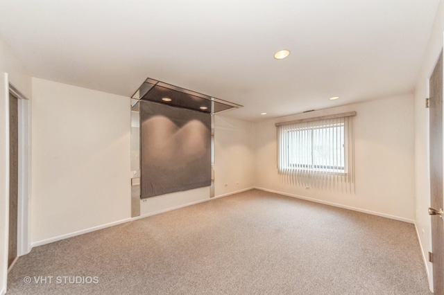 unfurnished room with recessed lighting, carpet flooring, and baseboards