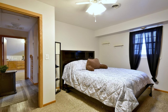 bedroom with baseboards, visible vents, and a ceiling fan