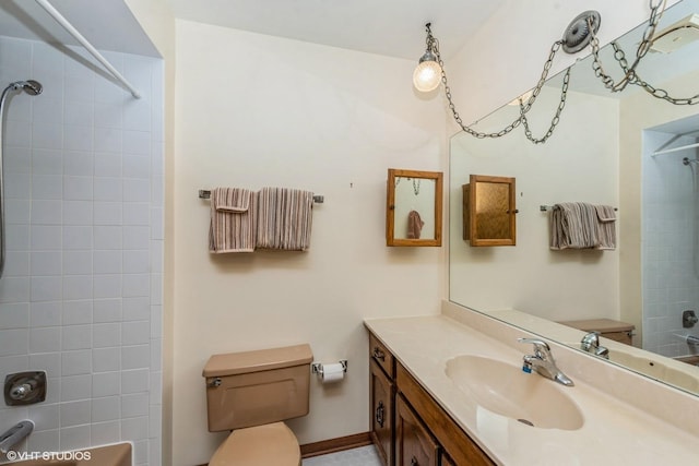 bathroom featuring vanity and tiled shower / bath