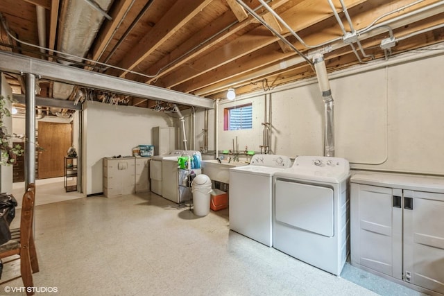 basement featuring washer and dryer