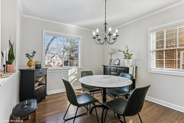 dining space featuring an inviting chandelier, crown molding, baseboards, and dark wood-style flooring