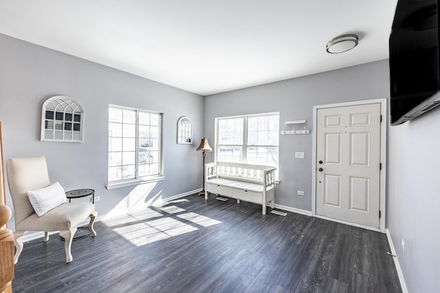 unfurnished room featuring dark wood finished floors and baseboards