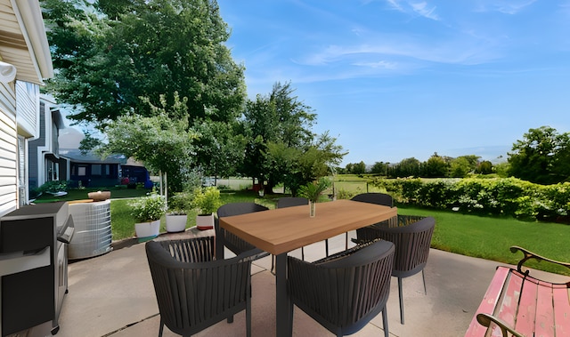 view of patio with outdoor dining space and central air condition unit