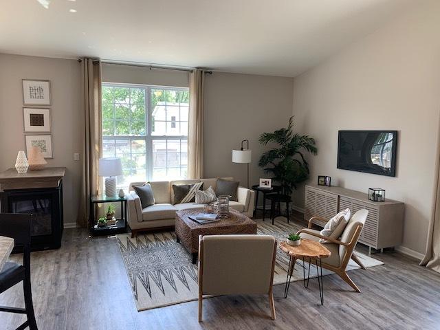 486 Ridge Ln, Bolingbrook, IL 60440 - living room featuring wood-type flooring and a fireplace