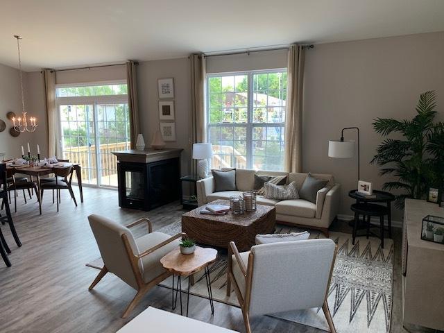 486 Ridge Ln, Bolingbrook, IL 60440 - living room with an inviting chandelier and light wood-type flooring