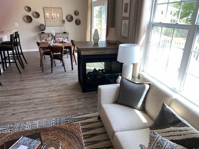 486 Ridge Ln, Bolingbrook, IL 60440 - living room with wood-type flooring and an inviting chandelier