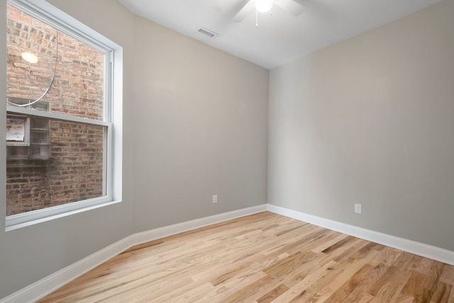 unfurnished room featuring ceiling fan, plenty of natural light, and light hardwood / wood-style flooring