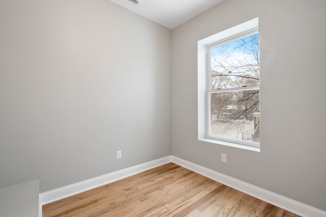 spare room with light hardwood / wood-style floors