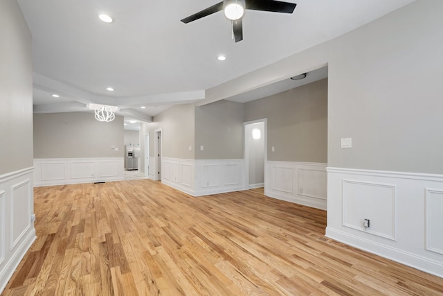 empty room featuring ceiling fan and light wood-type flooring