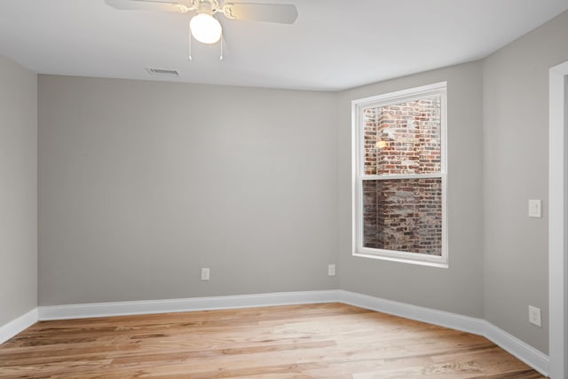 spare room featuring ceiling fan and light hardwood / wood-style floors