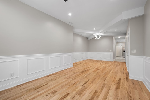 spare room featuring light wood-type flooring