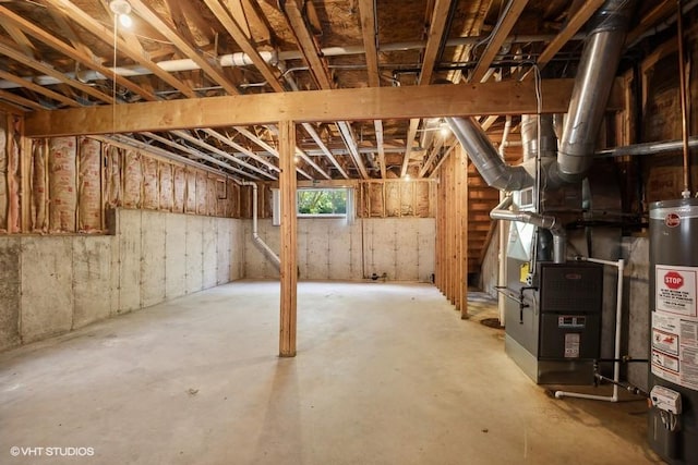 basement with water heater and heating unit